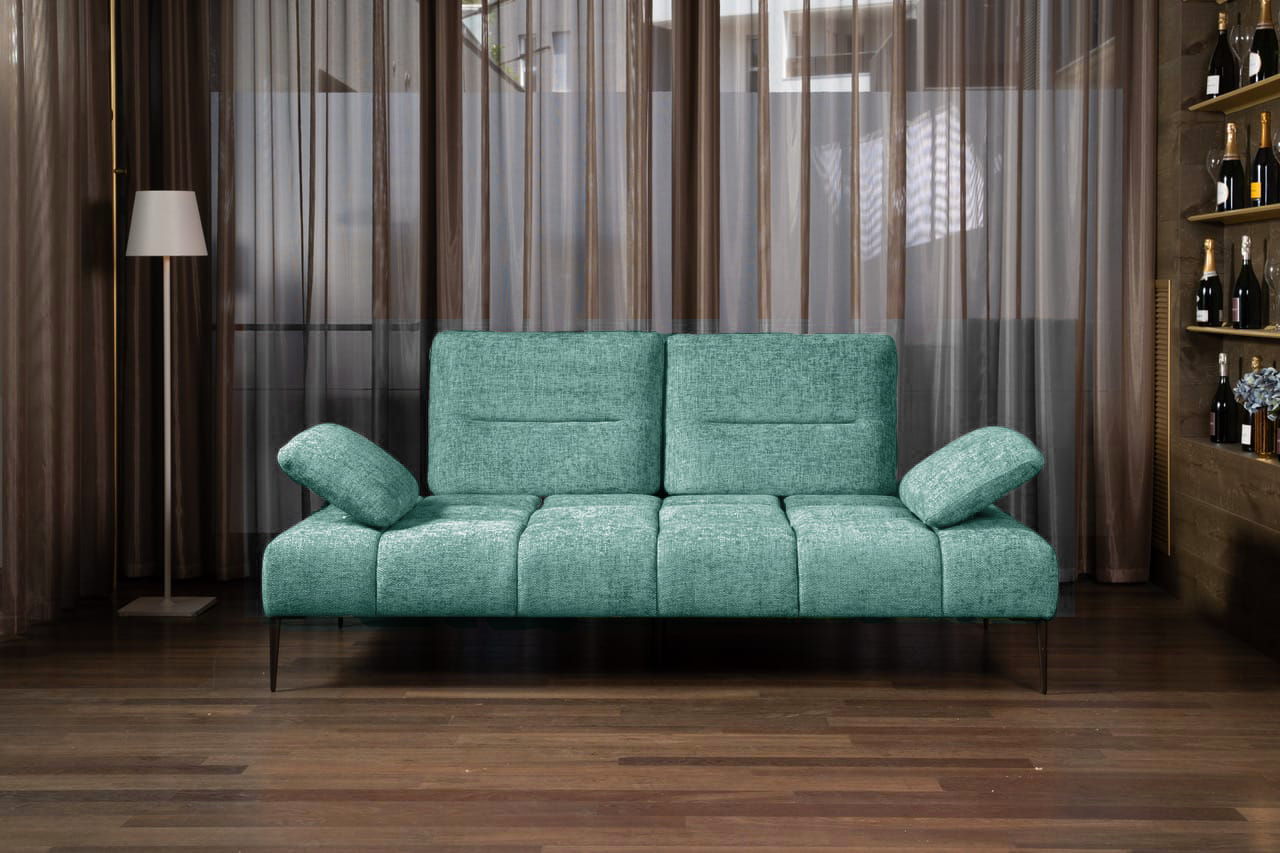 Modern Canapé Soul sofa with adjustable armrests, featuring a teal fabric design on wooden flooring in a stylish living room setting.